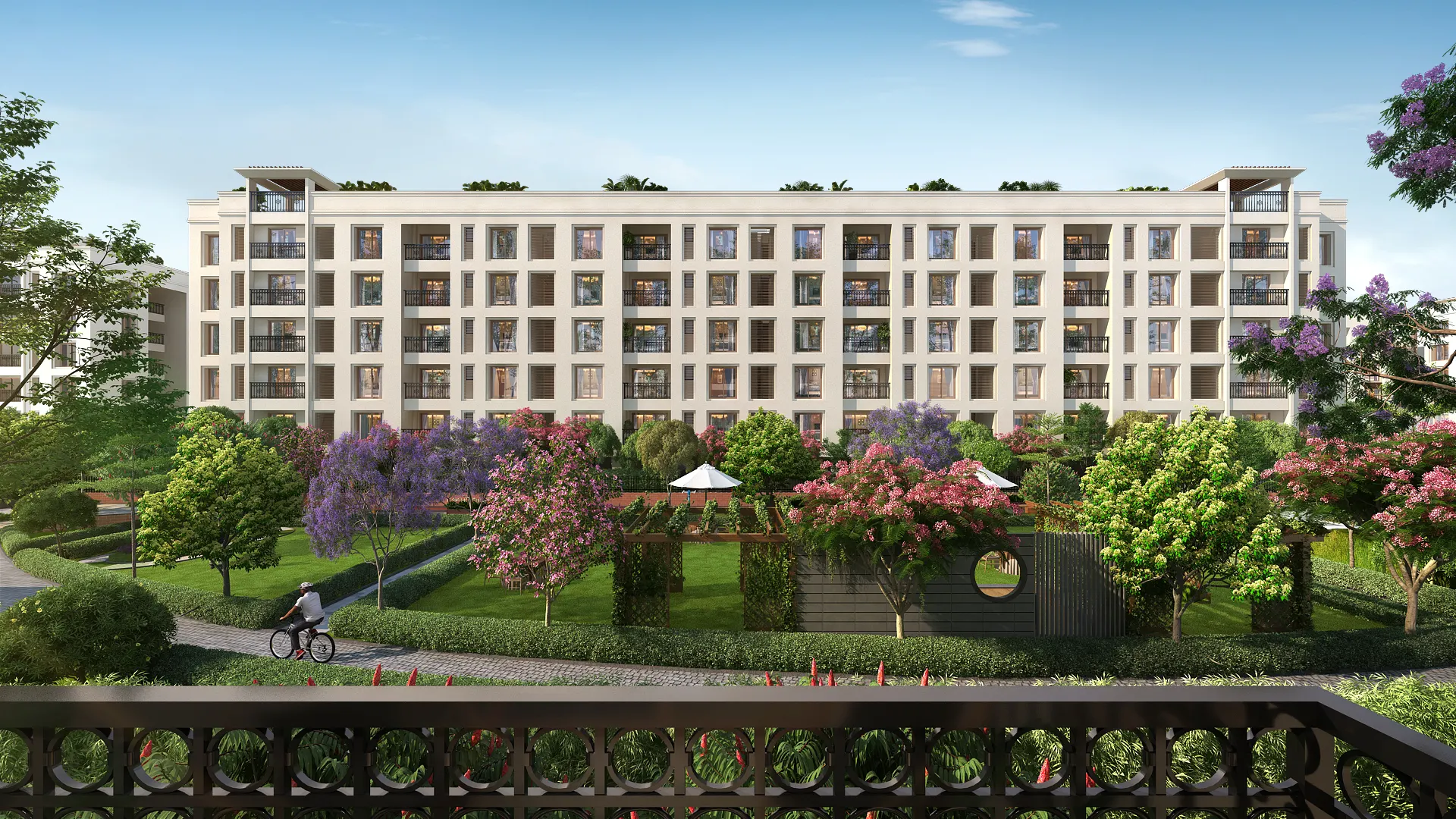 Garden-facing view of modern apartments in Porur at Nutech Central Park, showcasing lush greenery and spacious flats