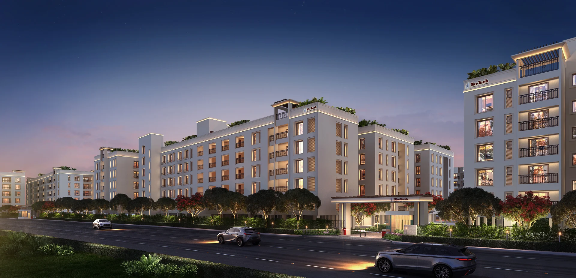 Night-time exterior of contemporary apartments in Porur, highlighting premium flats and landscaped spaces